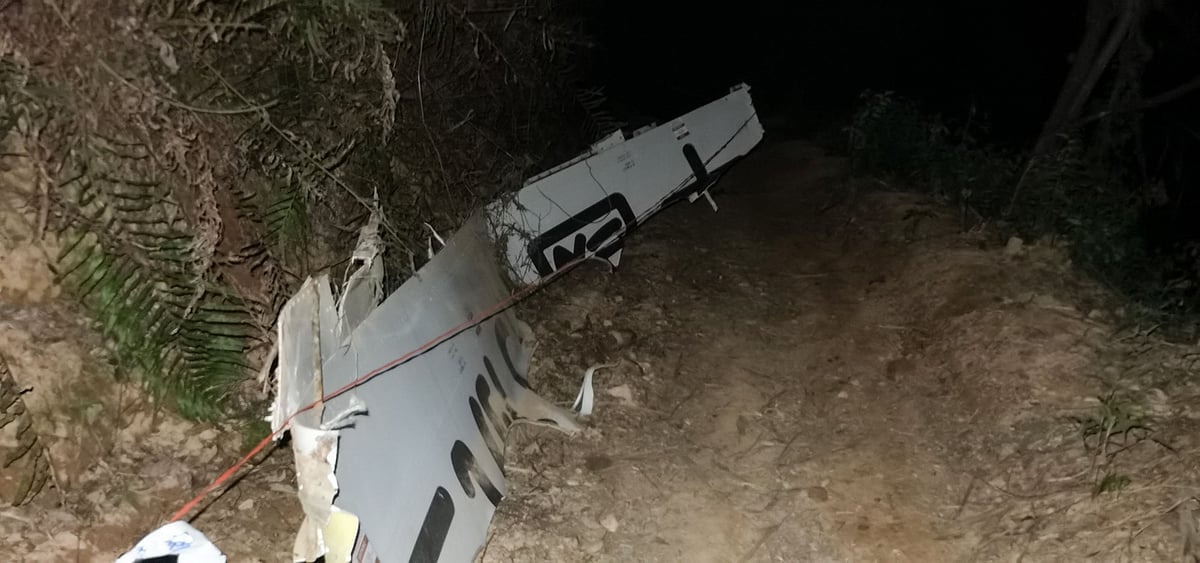 This photo taken on March 21, 2022 shows part the wreckage of a China Eastern passenger jet which crashed onto a mountainside in Tengxian county, Wuzhou city, in Chinas southern Guangxi region. | (Photo by AFP) / China OUT