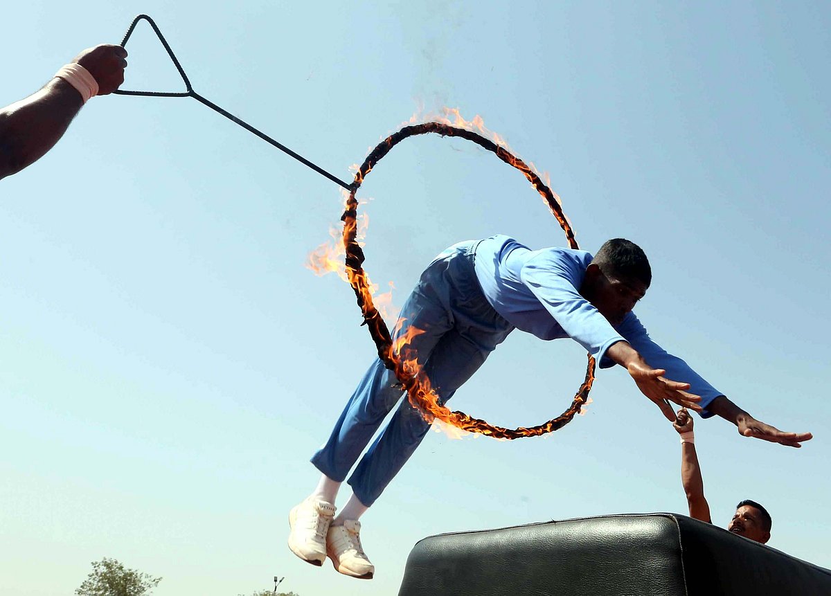 A personnel showing daredevil stunts at the passing out parade at Sashastra Seema Bal Academy in Bhopal on Tuesday