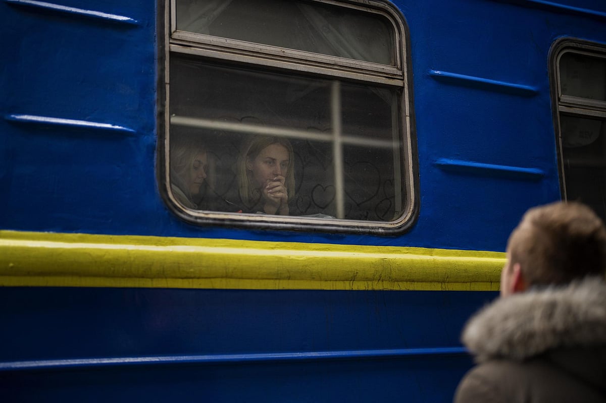 Bogdan, 41, says goodbye to his wife Lena, 35, on a train to Lviv at the Kyiv station, Ukraine, on Thursday