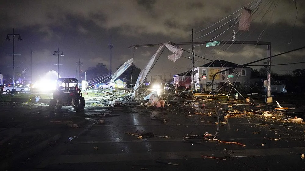 A debris lined street is seen in the Lower 9th Ward, Tuesday, March 22, 2022, in New Orleans, after strong storms moved through the area | AP