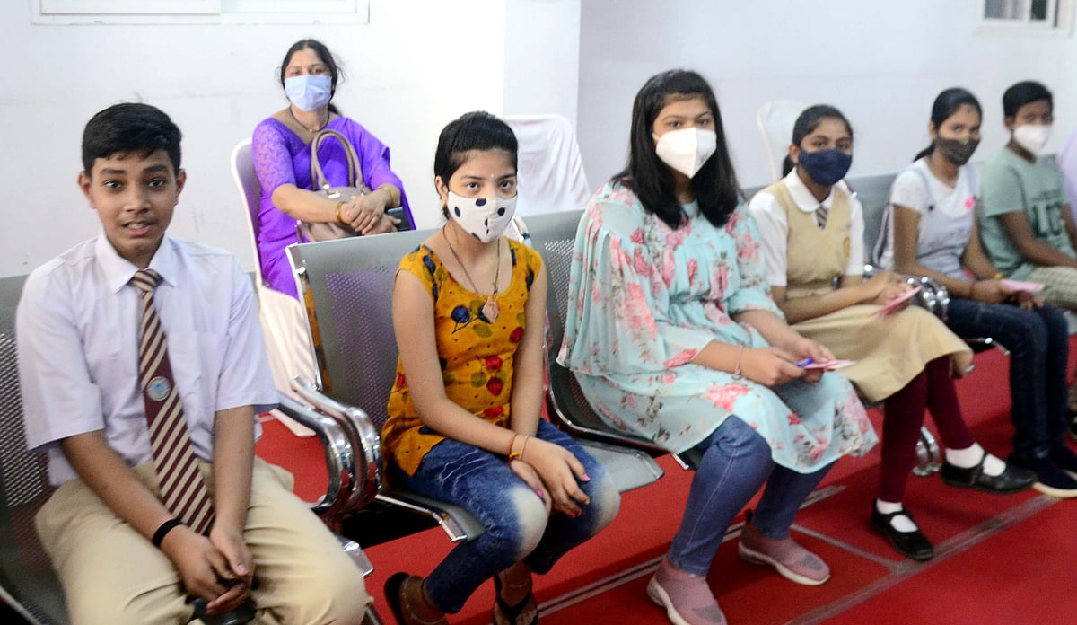 Children wait for their turn for vaccine in Bhopal on Wednesday