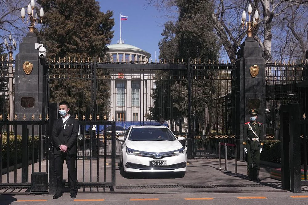 A Chinese paramilitary policeman stands guard a the entrance to the Russian Embassy in Beijing, on Tuesday | AP