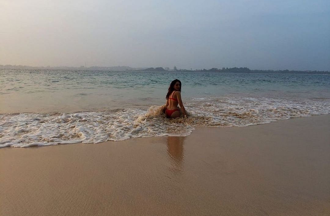 Sexy Sobhita Dhulipala sizzles in a red bikini at the seashore