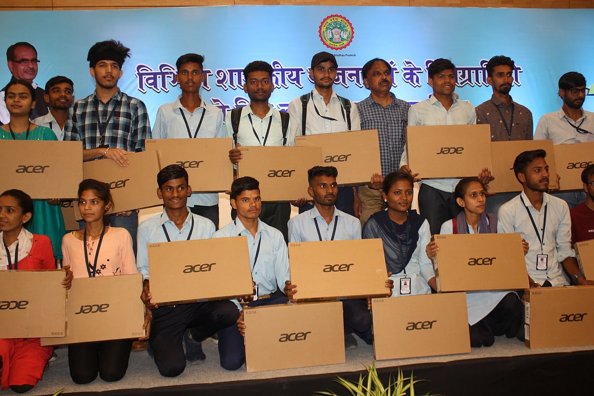 Indore: Home minister Narottam Mishra gives laptops to divyangs