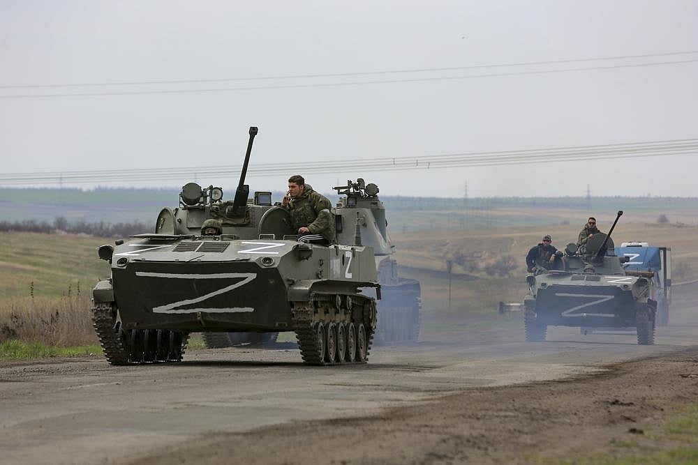 Russian military vehicles move on a highway in an area controlled by Russian-backed separatist forces near Mariupol, Ukraine, on Monday, April 18, 2022 | AP