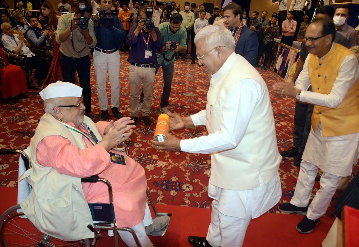 Governor Mangubhai Patel felicitates former Governor of Uttar Pradesh with Champion of Change at Minto Hall on Tuesday. 