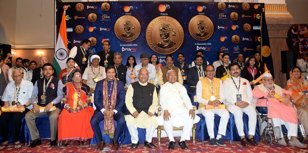 All winners of Champion of Change  pose with Governor Mangubhai Patel after felicitation at Minto Hall on Tuesday. 
