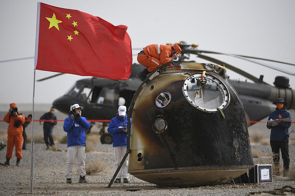 Chinese astronauts return to Earth after six months on space station
