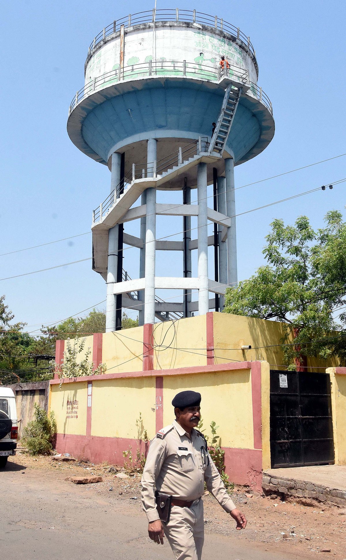Ritesh Goswami and his son climbed atop overhead water tank once gain to press their their demands in Bhopal on Wednesday. 