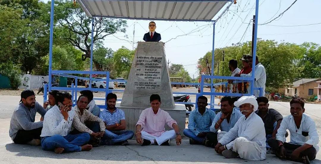 Sardarpur: Miffed with absence of officials from meeting MLA sits on dharna