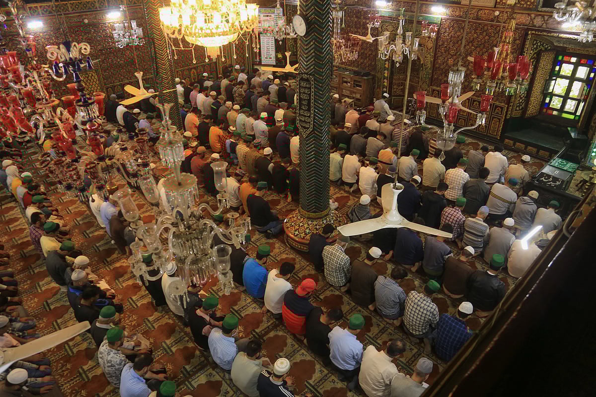 Kashmiri residents pray inside the shrine during the holy month of Ramadan in Srinagar, Kashmir