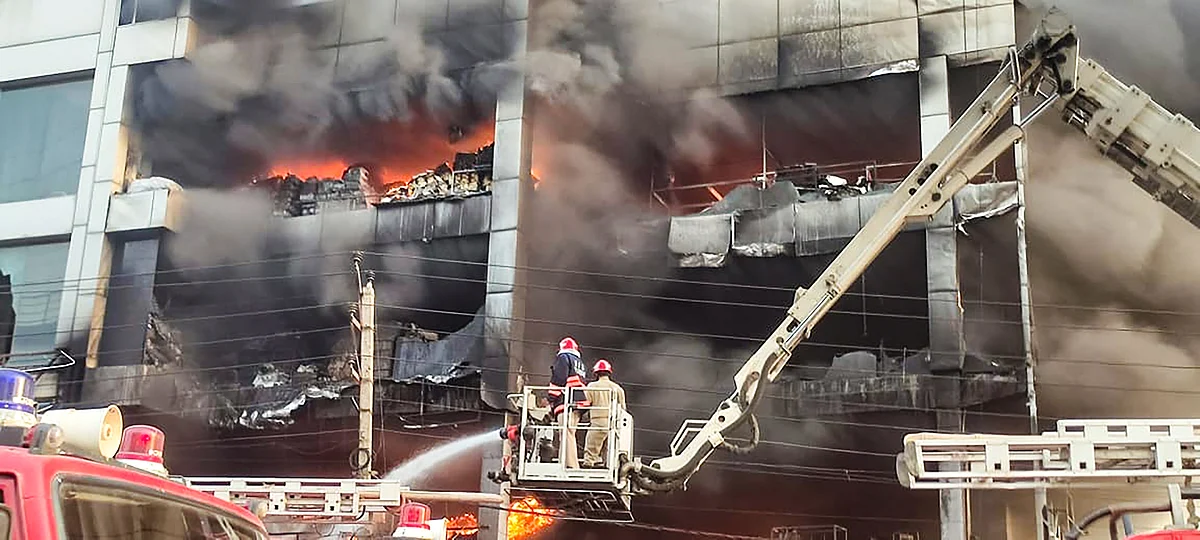 New Delhi: Firefighters try to douse a fire that broke out in a building at Mundka, in West Delhi, Friday, May 13, 2022.  | (PTI Photo)