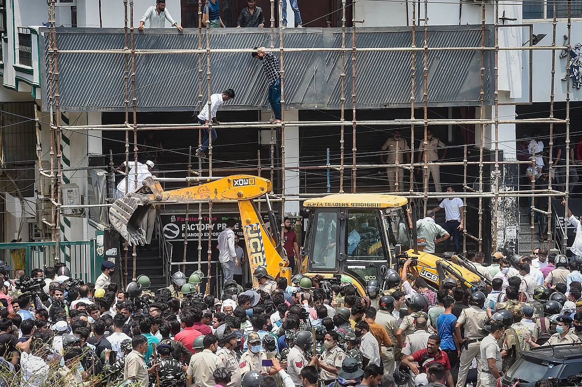 Locals stage a protest during an anti-encroachment drive by Municipal Corporation of Delhi (MCD), at Shaheen Bagh area in New Delhi, Monday, May 9, 2022. | PTI