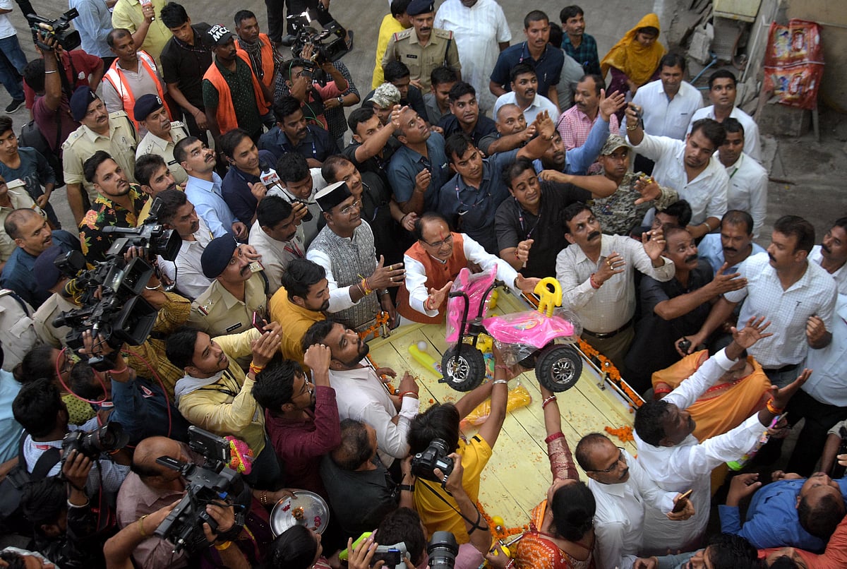 Chief Minister Shivraj Singh Chouhan accepting gifts from people donated for anganwadi children in Bhopal on Tuesday