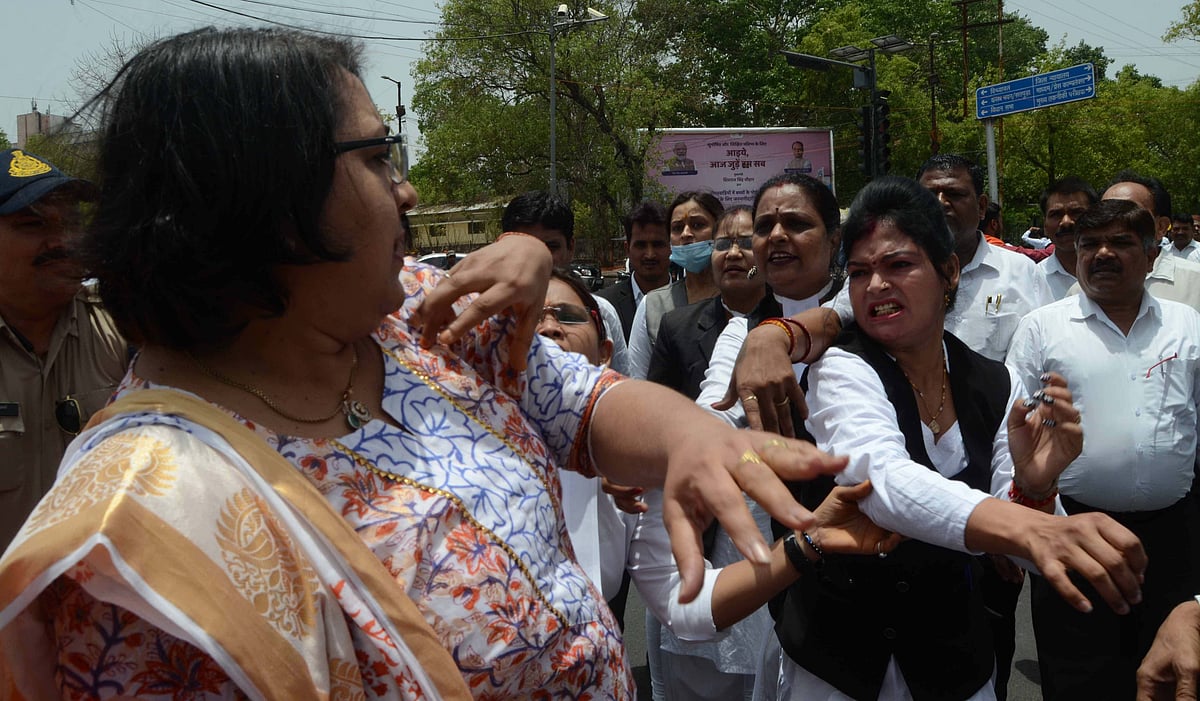 A lawyers seen 'hitting' a government staffer during a protest in front of the district court  in Bhopal on Tuesday 