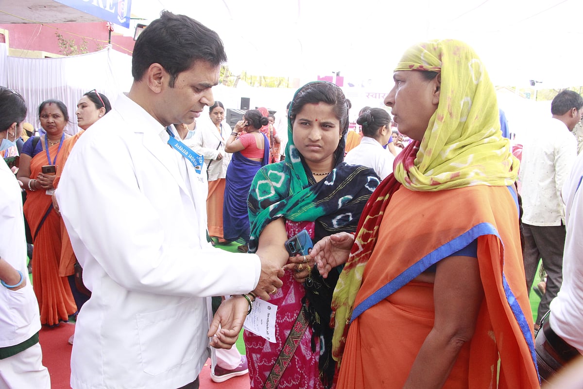  Doctor consulting a patient in the health mela.