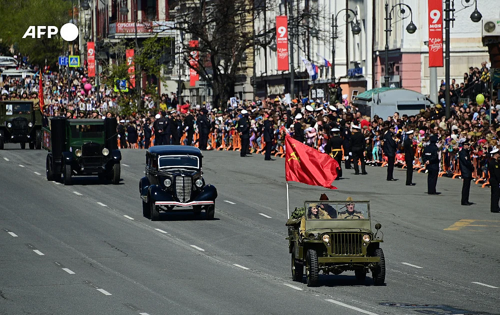 People in Vladivostok take to the streets to watch the annual parade marking Russia's 1945 victory over Nazi Germany