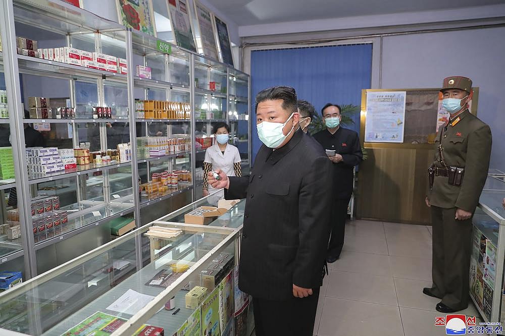 In this photo provided by the North Korean government, North Korean leader Kim Jong Un, center, visits a pharmacy in Pyongyang, North Korea on Sunday, May 15, 2022 | AP