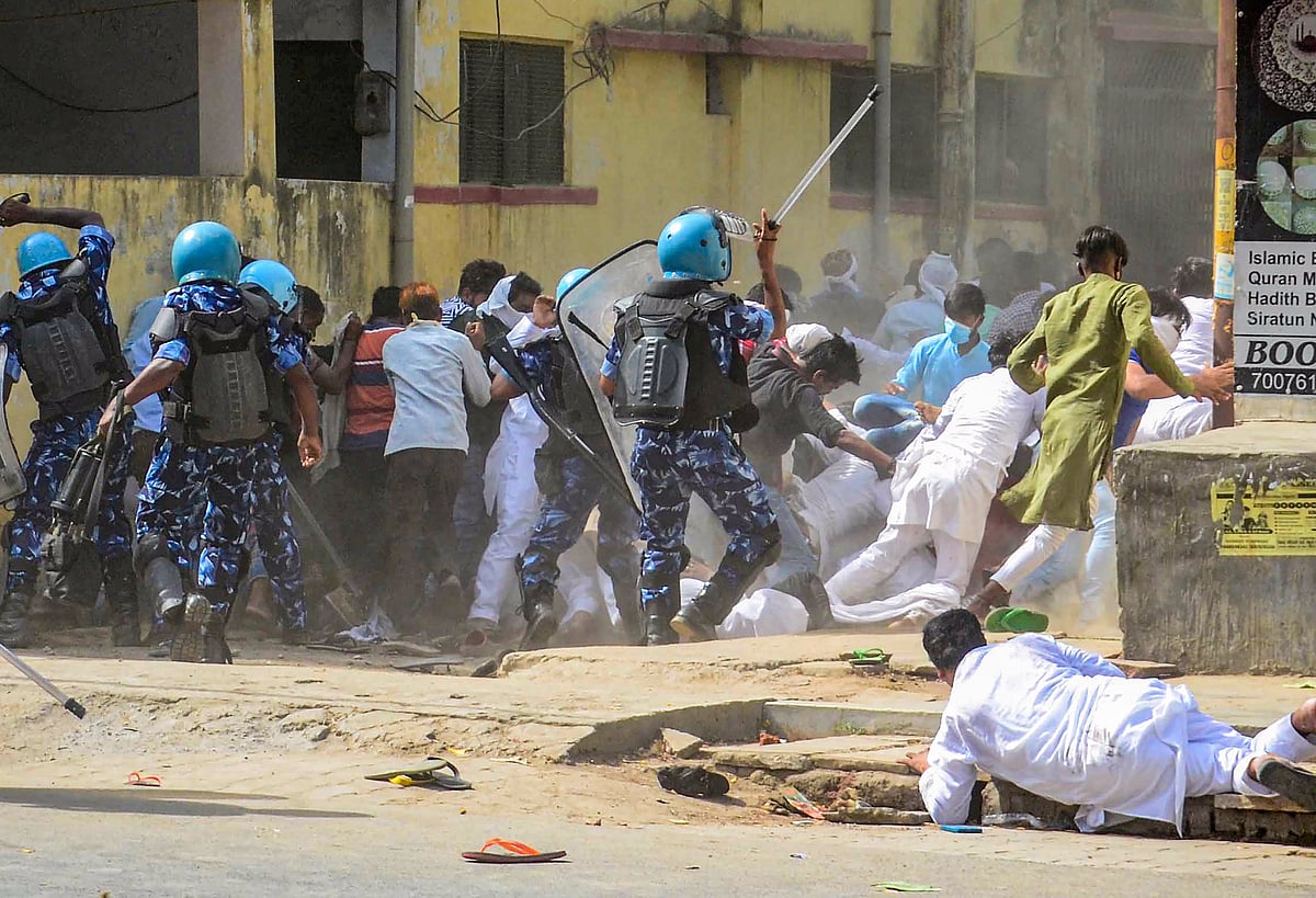 Prayagraj: Rapid Action Force (RAF) personnel in a scuffle with protestors during a protest over controversial remarks made by two now-suspended BJP leaders about Prophet Mohammad, at Atala area in Prayagraj, Friday, June 10, 2022.  | -(PTI Photo)