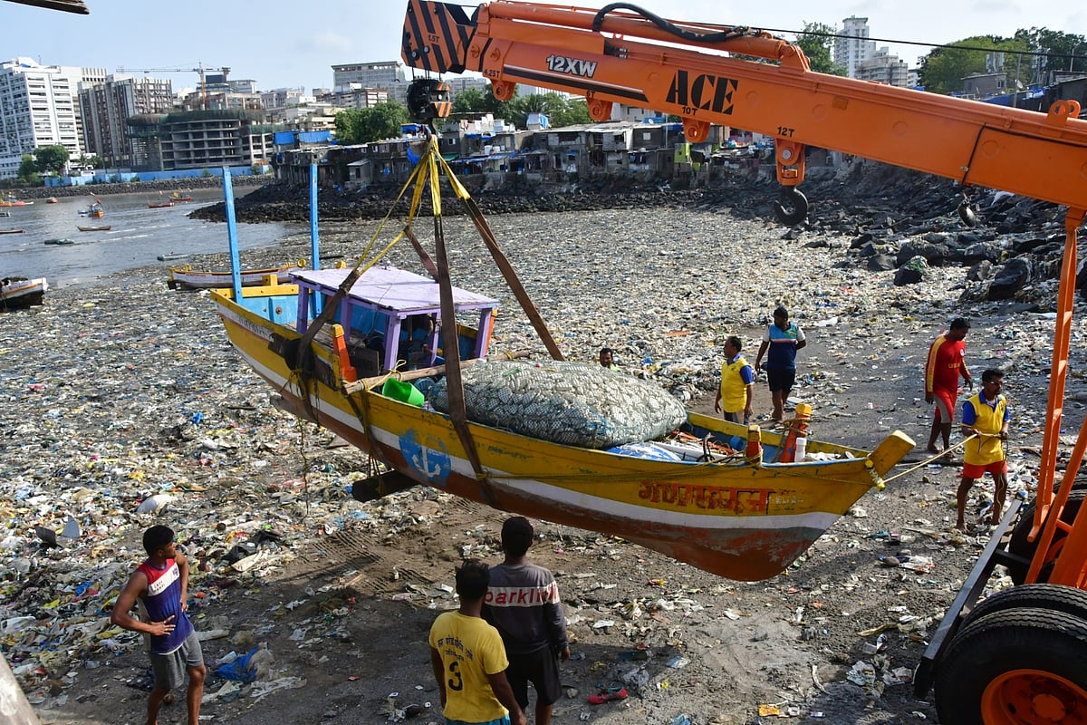 In Pics: Mumbai fishermen use crane to move their boats before monsoon starts