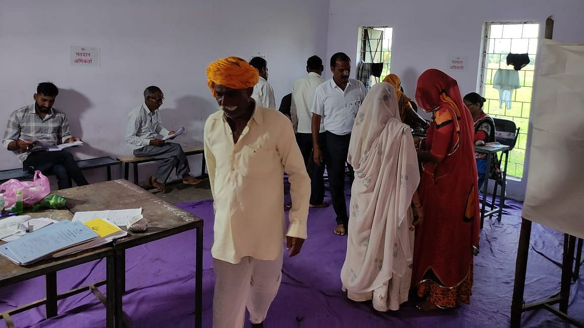 A large number of male and female voters at a polling station for the third and final round of Panchayat body elections of the district, in Ujjain on Friday  | FP PHOTO