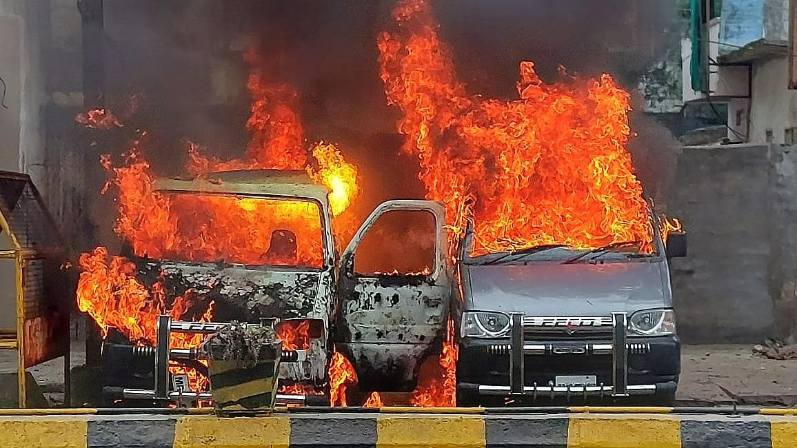 The vans which caught fire opposite Tejankar Hospital in Ujjain on Saturday  | FP PHOTO