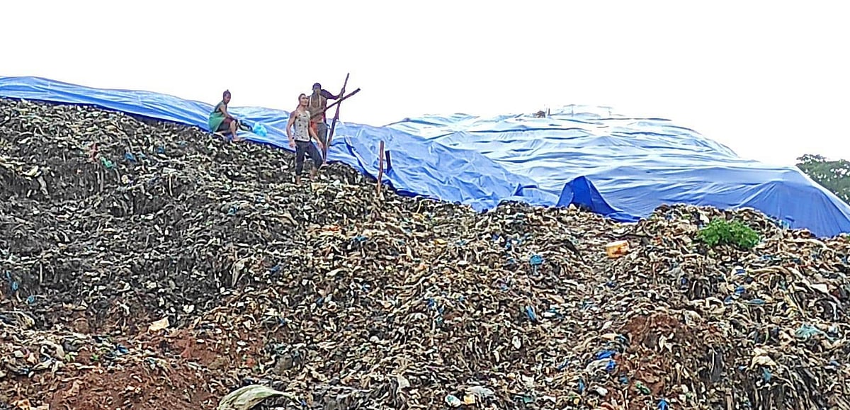 Goa: GWMC on the job to cover portion of uncovered dump with tarpaulin