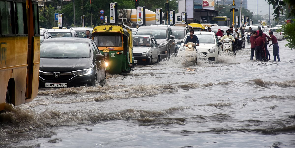Mixed traffic lane of BRTS submerged in rainwater.