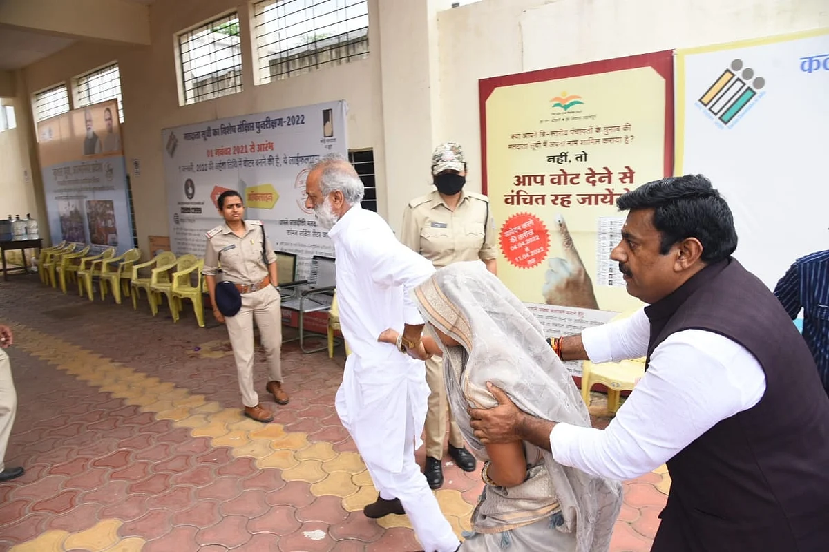 BJP cupported candidate Ramkunwar Navrang Gurjar being escorted by MLA Rameshwar Sharma and BJP leader Shaitan Pal Singh for voting at the centre in Zila Panchayat office on Friday