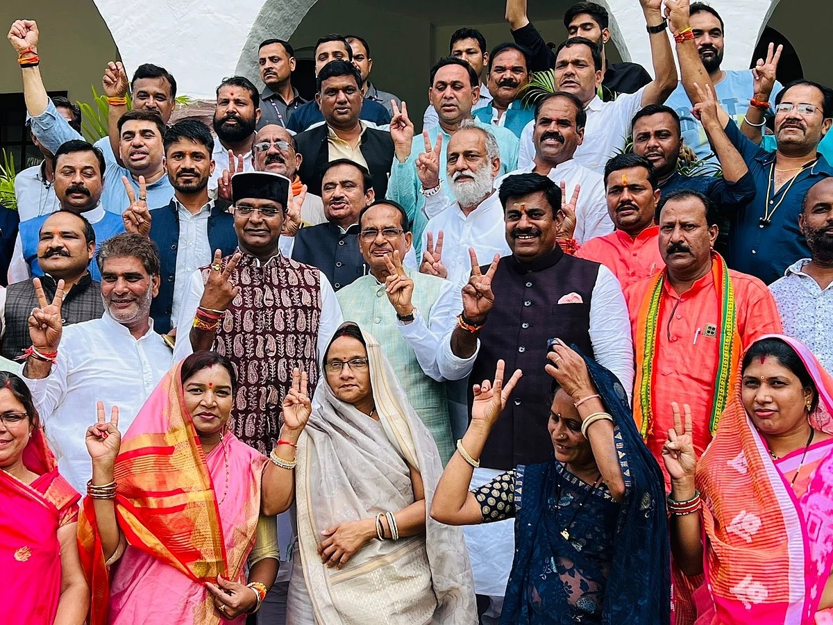 Chief Minister Shivraj Singh Chouhan and others with newly elected Zila Panchayat president Ram Kunwar Navrang Gurjar (in grey saree) on Friday.  | FP