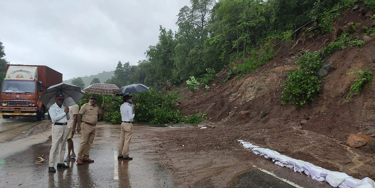 The Traffic Police regulating traffic due to landslide at Waghoba Khind in Palghar.
 | 