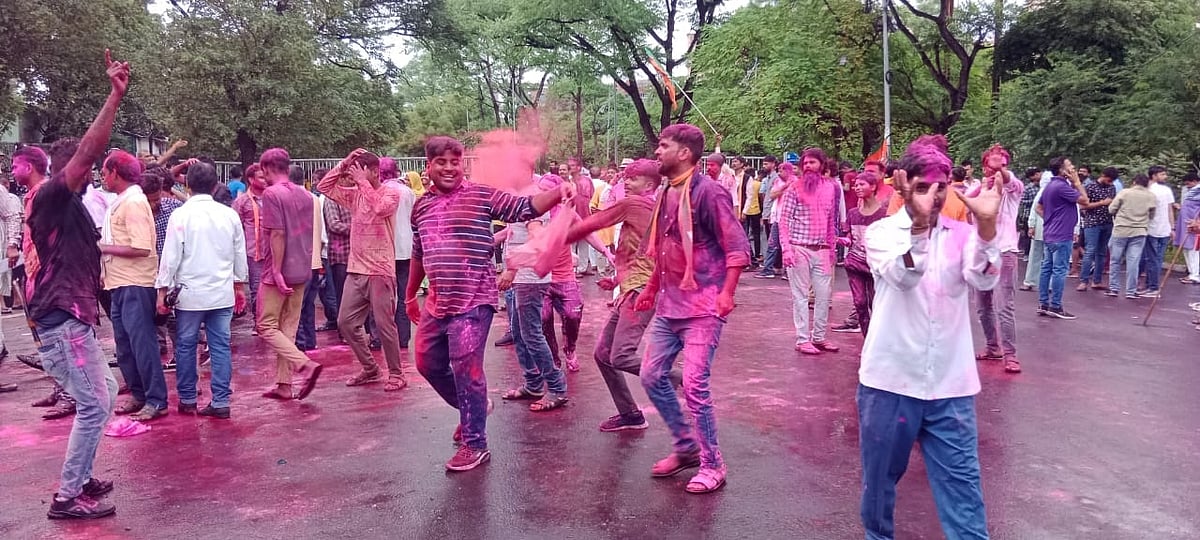 BJP workers dance on road to celebrate victory in Bhopal on Sunday. | FP