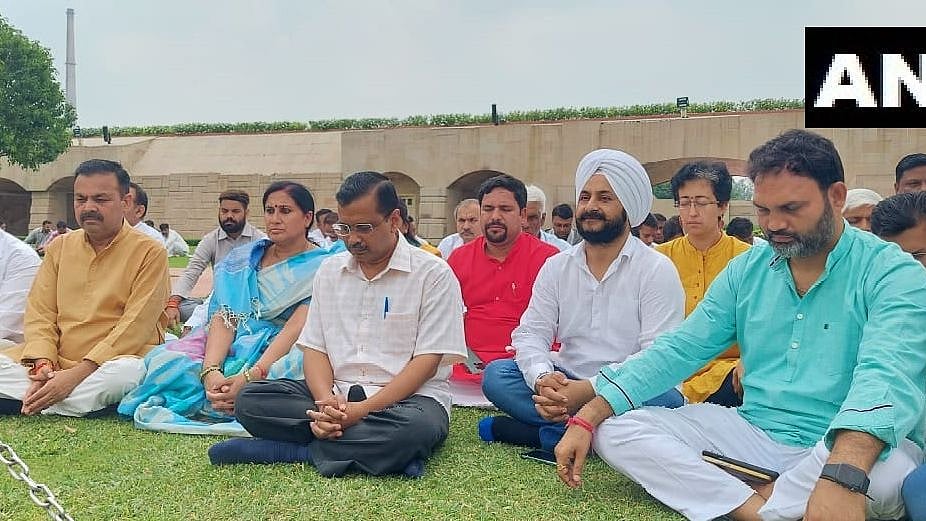Arvind Kejriwal and AAP MLAs symbolic sit-in at Mahatma Gandhi's Rajghat; Kejriwal questions BJP's '800 crore offer' 