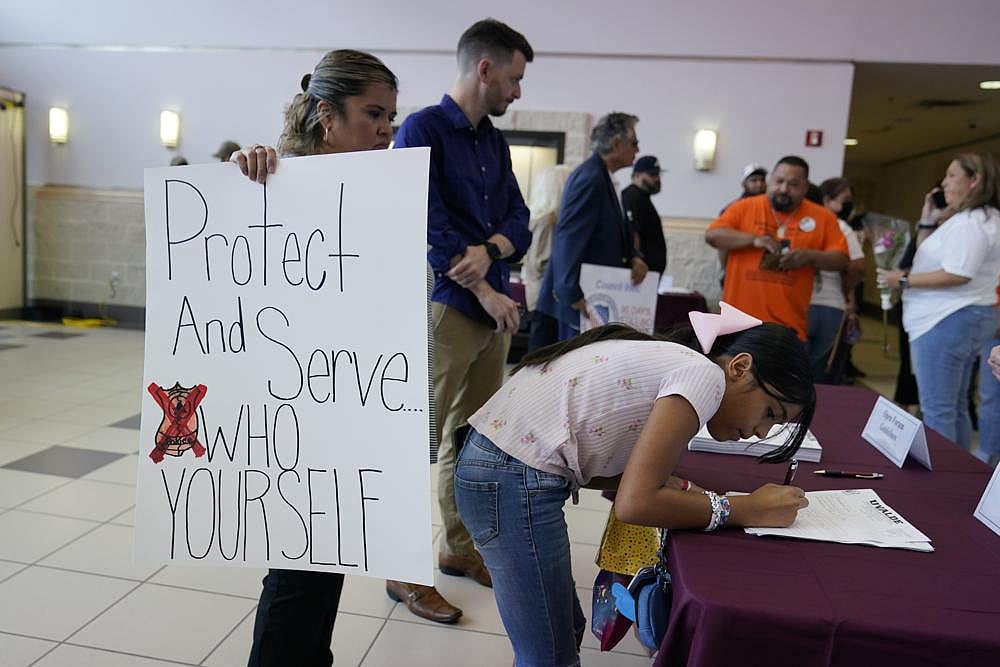 Parents, students and families arrive for a meeting of the Board of Trustees of Uvalde Consolidated Independent School District for a termination hearing to decide the employment fate of Uvalde School District Police Chief Pete Arredondo, on Wednesday, August 24, in Uvalde, Texas | AP