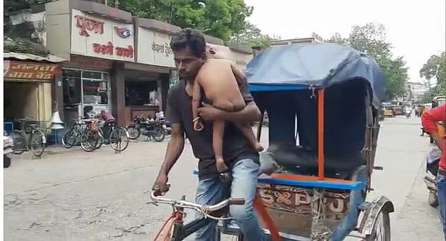 Watch: Man rides rickshaw holding his 1-year-old son on shoulder to earn livelihood in Jabalpur
