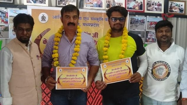 Sunil Uikey and his coach -Vivek Montrose (second and third from right) being felicitated by Adivasi Art and Culture Centre in the city on Friday.