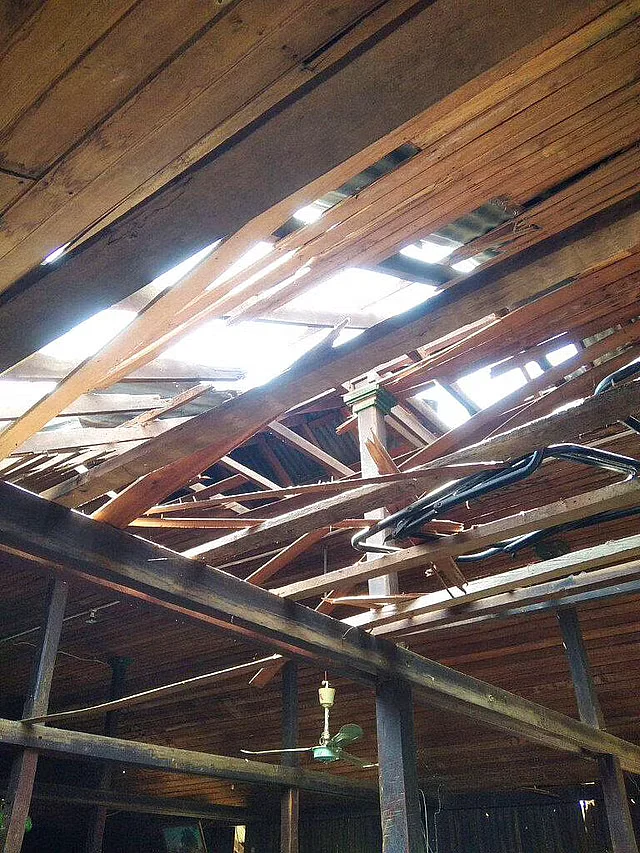 A damaged rooftop and broken wooden ceiling let sunlight into a middle school in Let Yet Kone village in Tabayin township