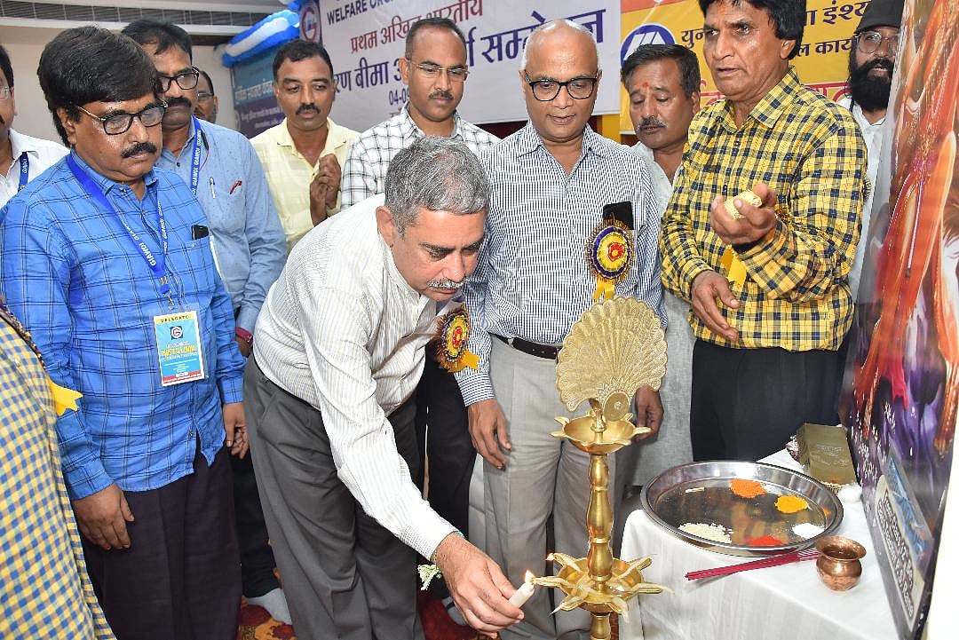 Guests light a traditional lamp to inaugurate the Mahakumbh of insurance agents, in Ujjain on Sunday.