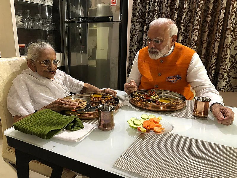 Prime Minister Narendra Modi meets his mother Heeraben Modi at her Gandhinagar residence on his 69th birthday.