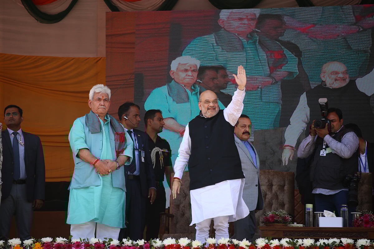 Amit Shah waves at crowd during a public rally at the Showkat Ali Stadium in Baramulla district of Kashmir