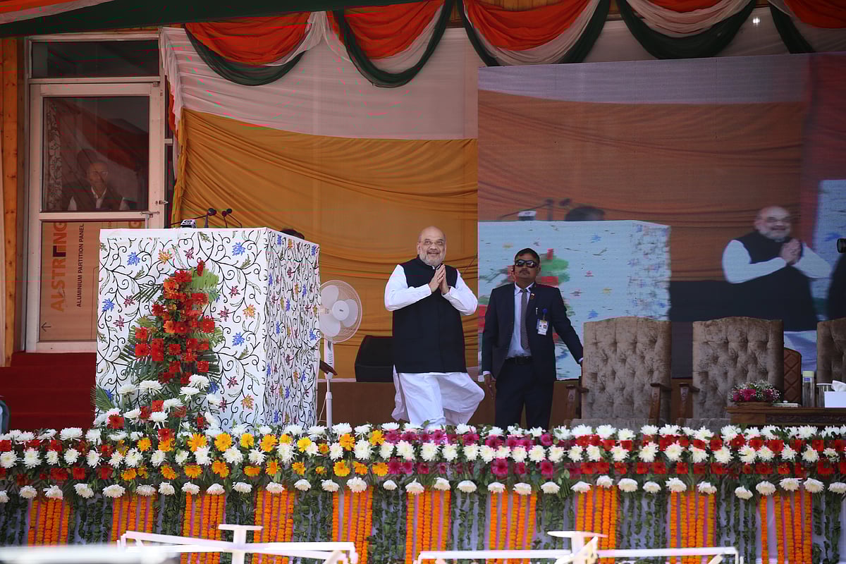 Amit Shah performs a greeting upon his arrival in Showkat Ali Stadium during public rally at Baramulla district of Kashmir