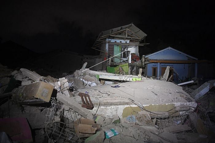 In Pics: Indonesia earthquake kills scores, reduces homes to rubble