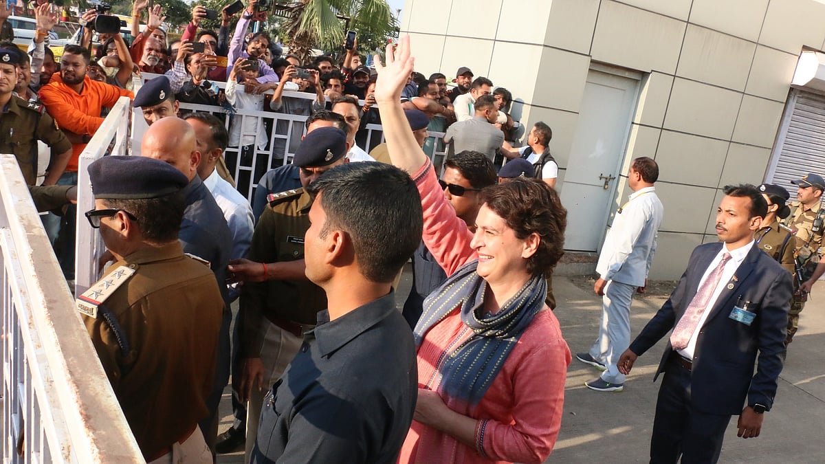 Congress leader Priyanka Gandhi waving at supporters outside the city airport on Wednesday