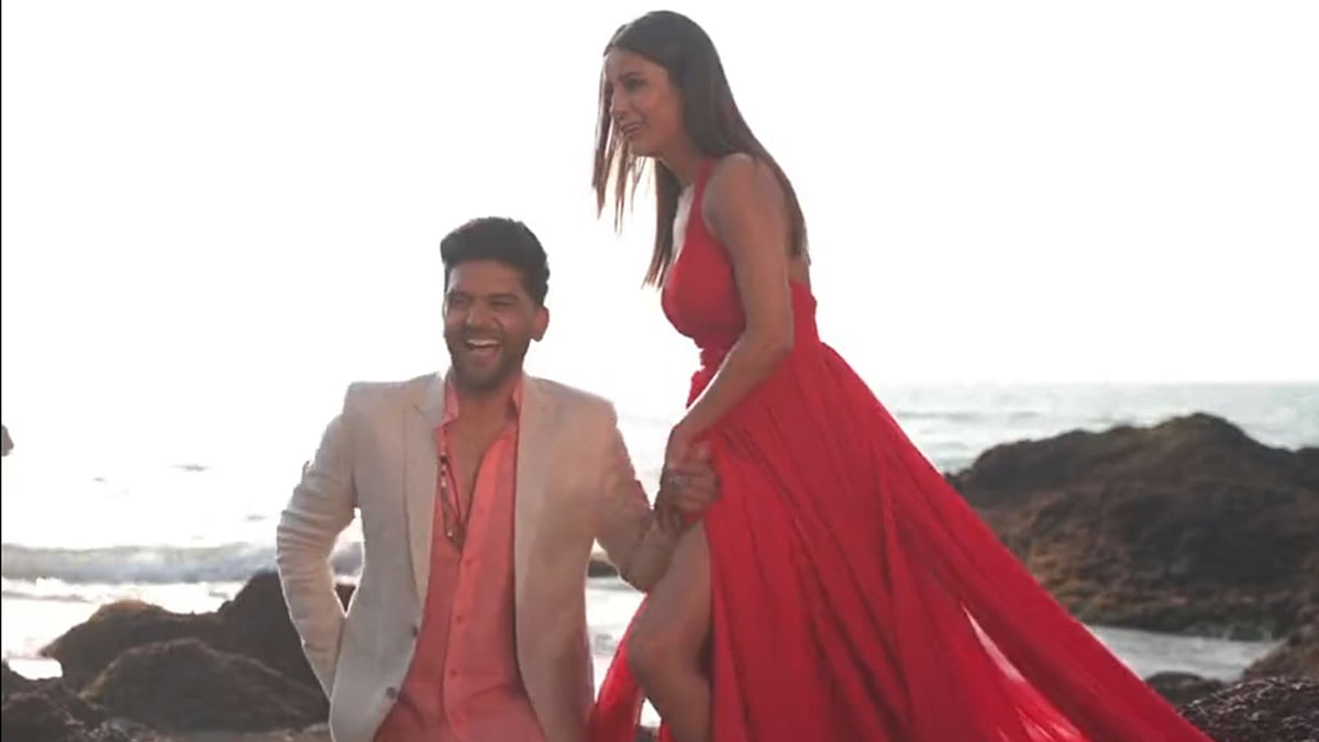 WATCH: Shehnaaz Gill makes Guru Randhawa blush with her slit-cut red dress 
