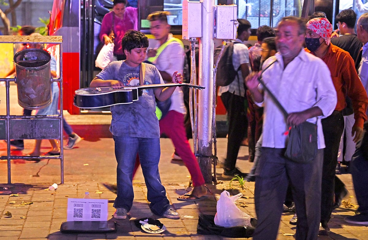 Debraj performs with a baseball cap by his feet in the hope of raising a sum that will take him to Berklee College of Music
