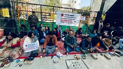 Delhi: Deprived of salaries, DU's Maharaja Agrasen College polish shoes in protest against Kejriwal govt