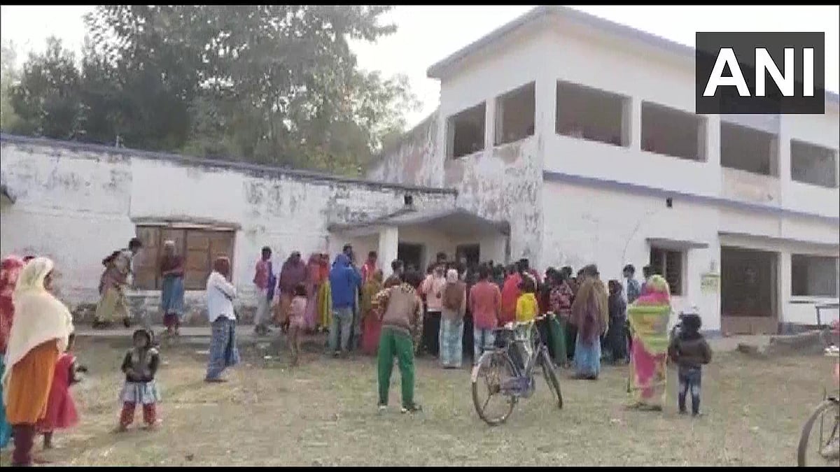 Locals outside the school in Malda where dead rat and lizard were found in mid-day meal.