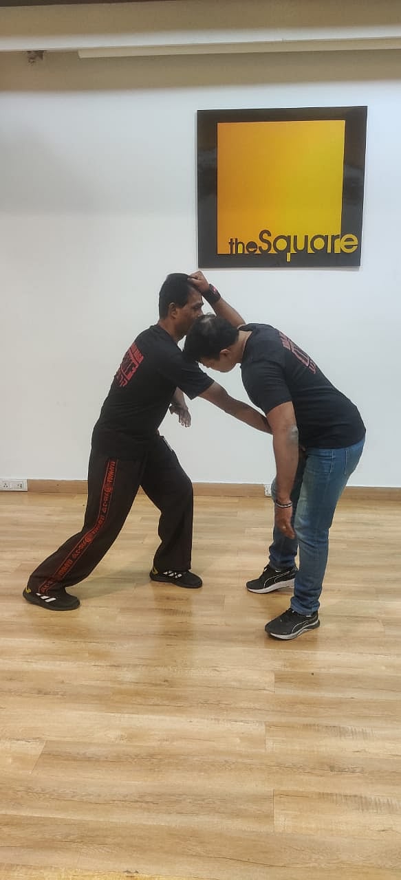 After defending the knee kick the defender hits the attacker on the groin/ IKMF