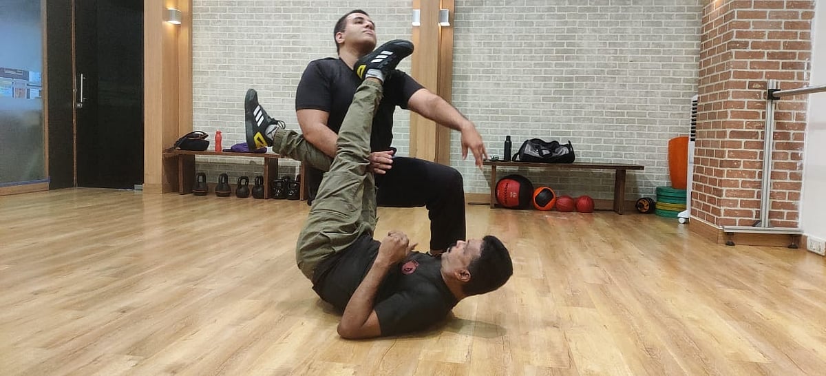 Kick him hard and make sure to get up fast and keep your guard up and check if there is any more attackers coming
