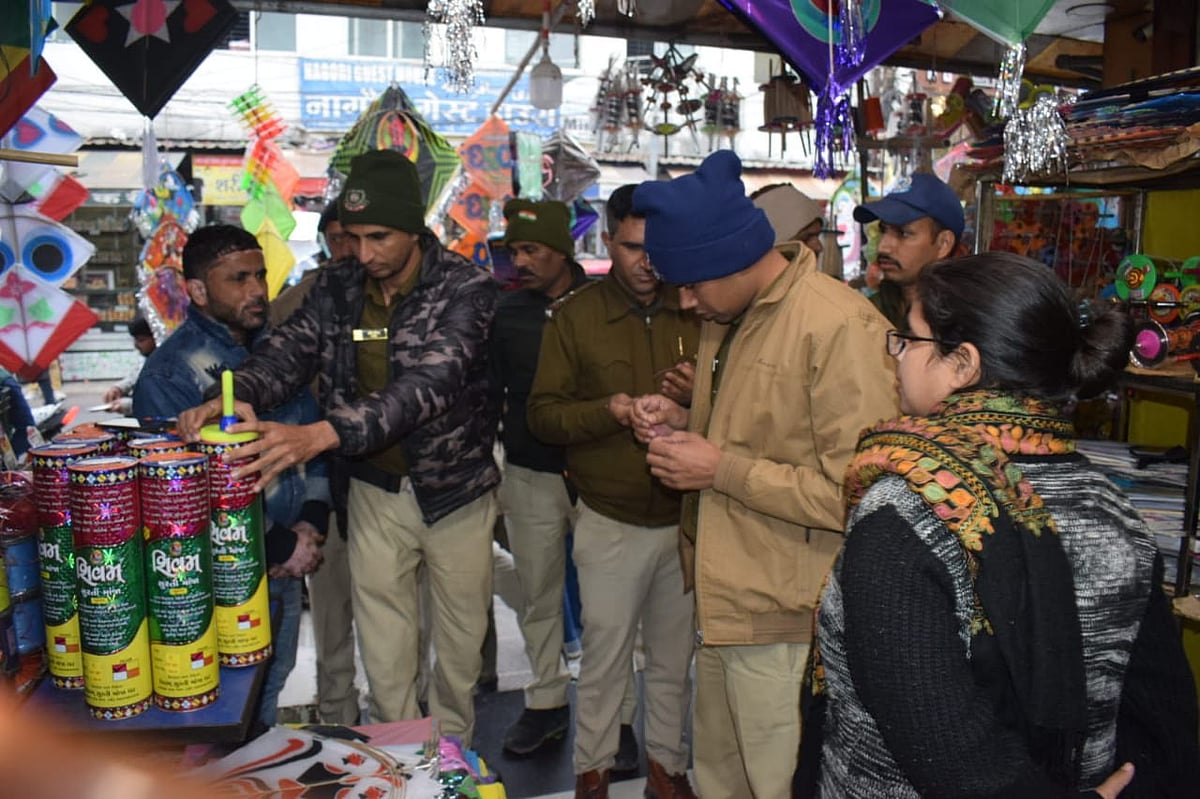 Policemen search a kite seller’s shop | 